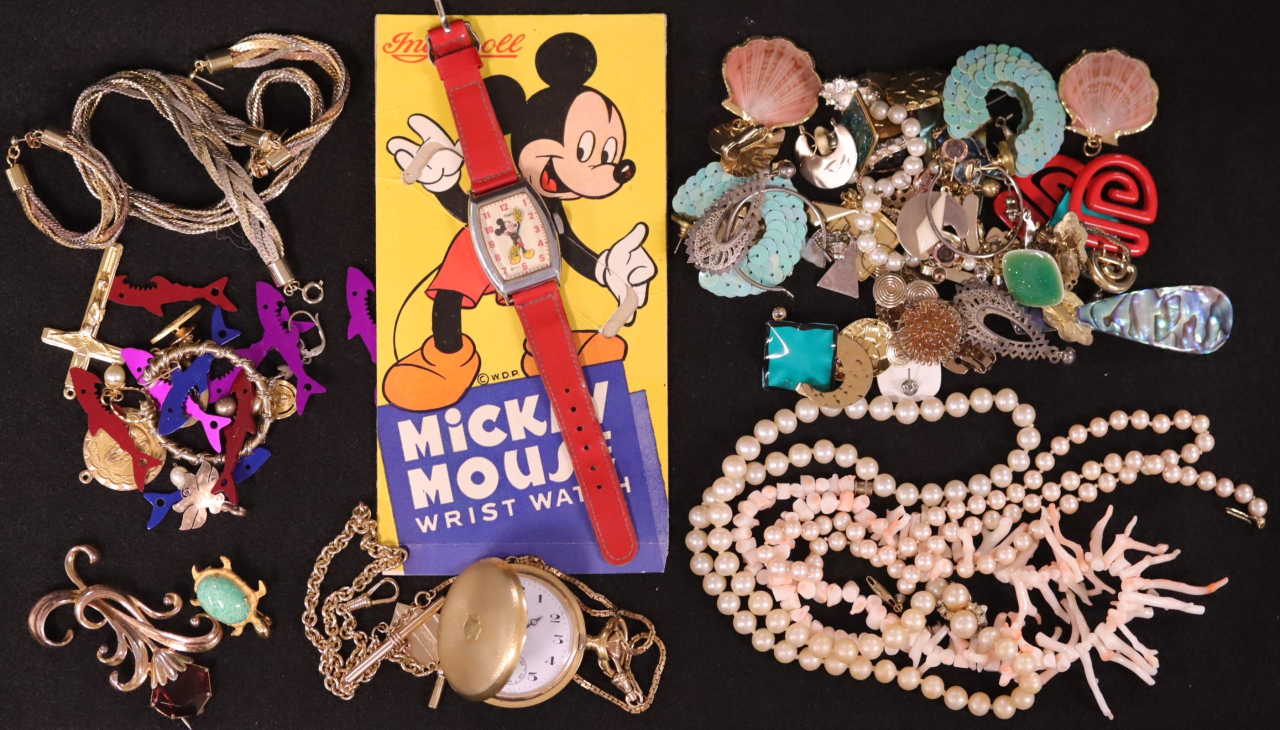 Mickey Mouse watch and other jewelry, including a pocket watch and necklaces