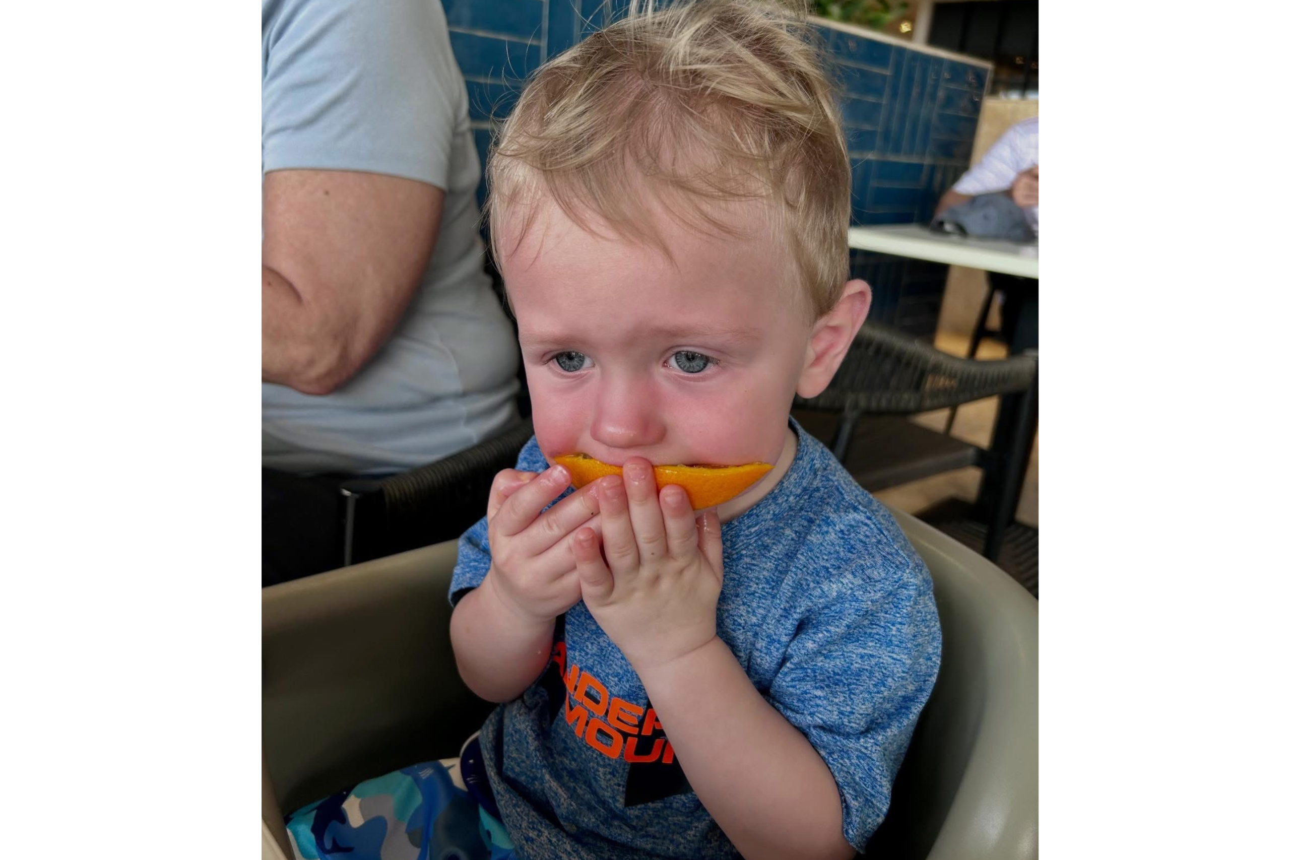 Treasurer Frerichs' son eating an orange