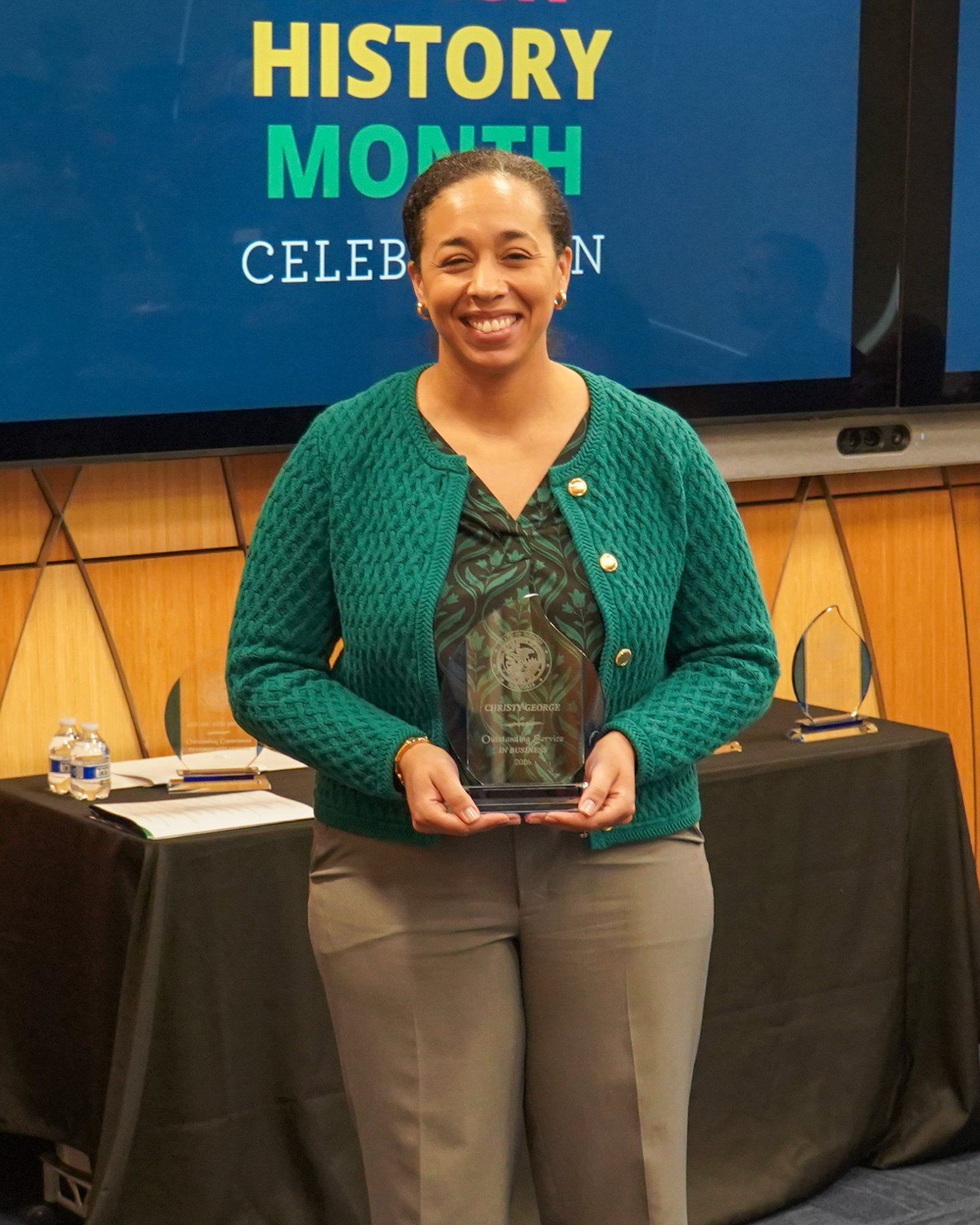 Christy George with her award at Treasurer Frerichs' Black History Month celebration