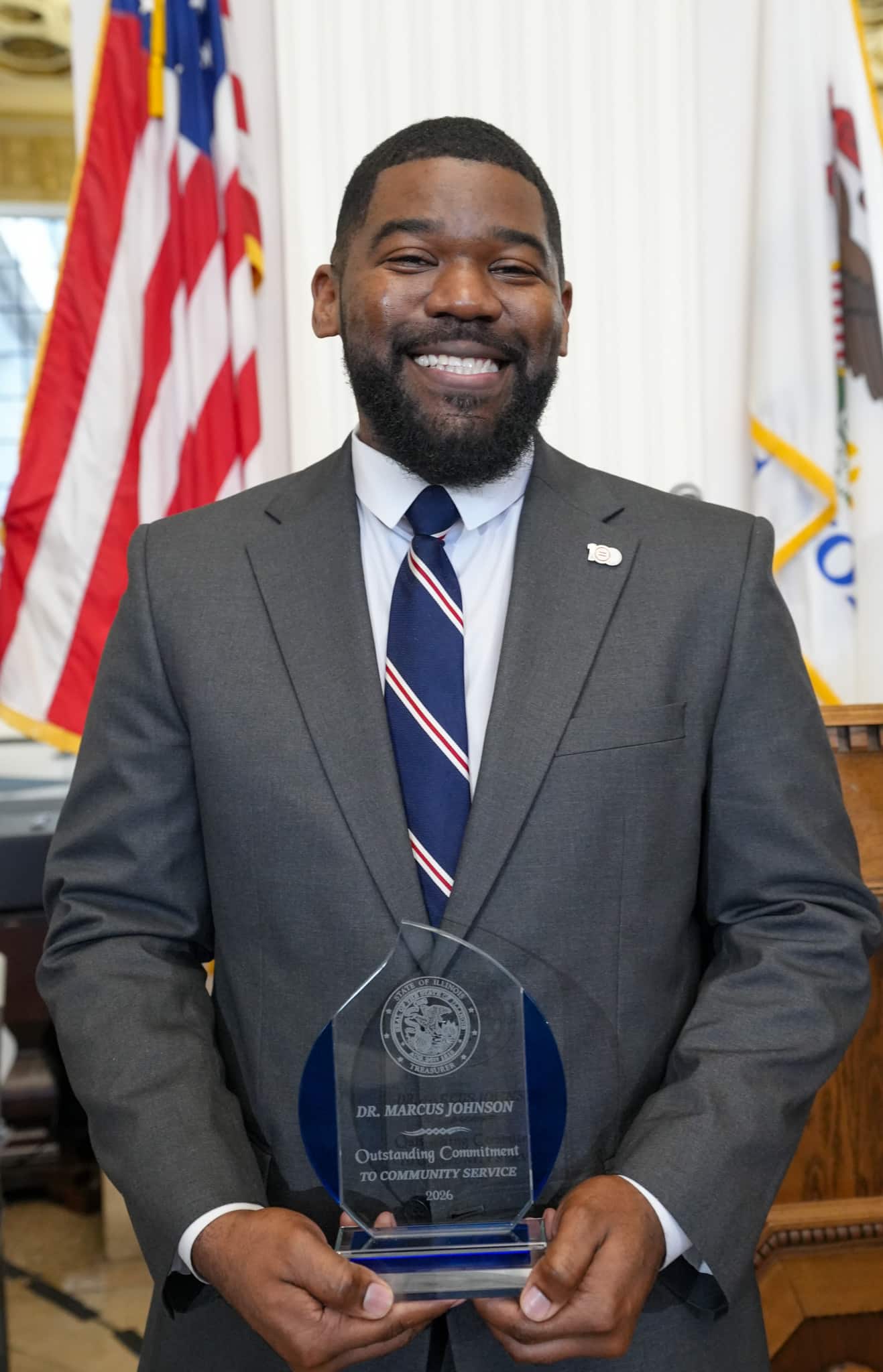 Christy George with her award at Treasurer Frerichs' Black History Month celebration
