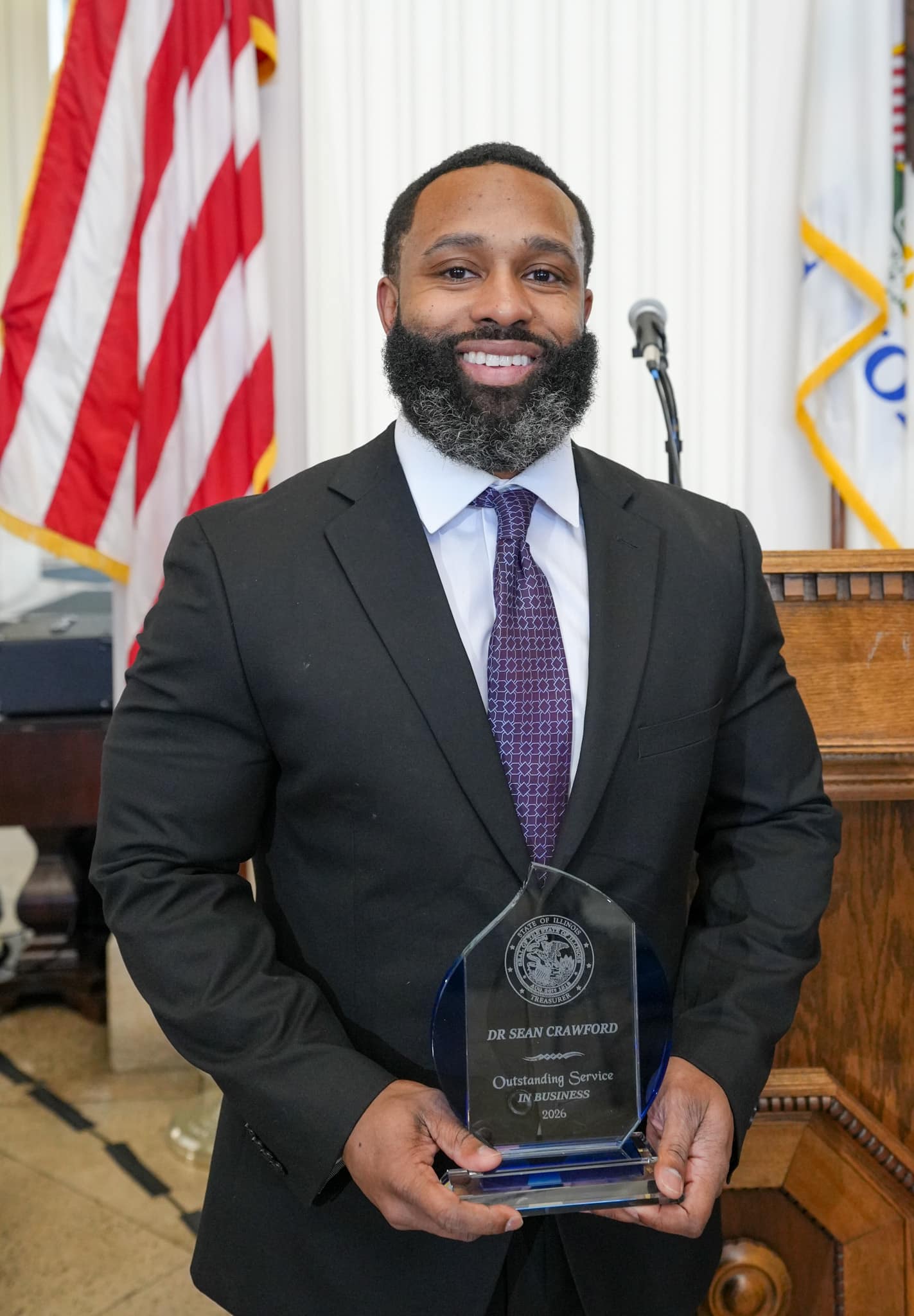 Christy George with her award at Treasurer Frerichs' Black History Month celebration