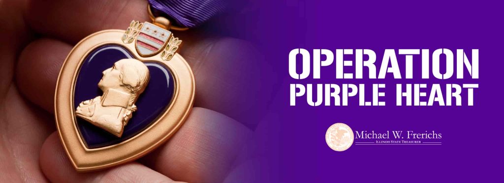 purple heart medal up closely held in a person's hand