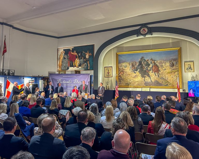 Casimir Pulaski Day press conference in a room with large painting in the wall celebrating a Polish general