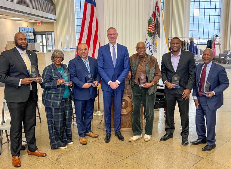 Springfield, IL Black History Month awardees standing in front of the US Flag