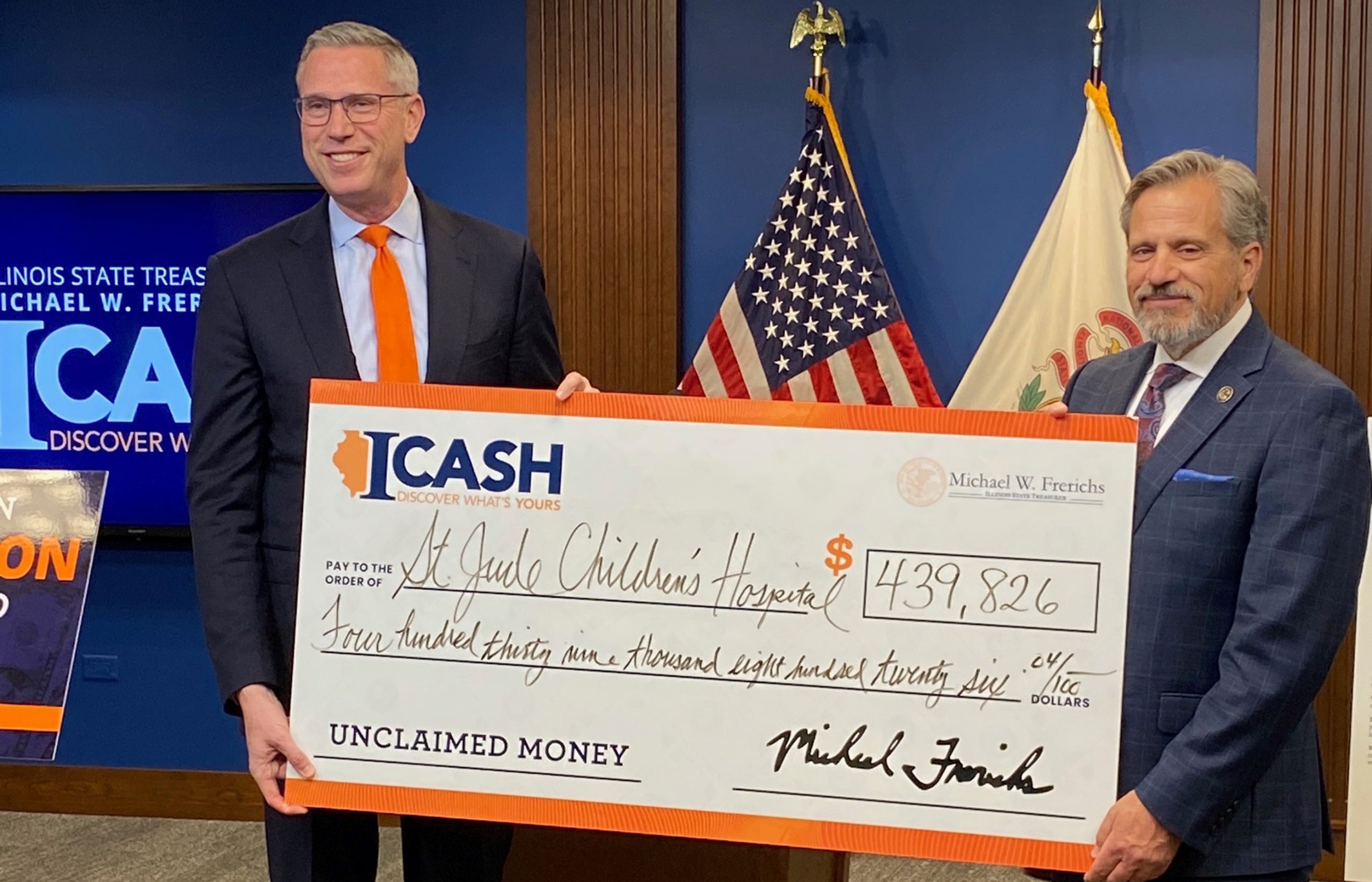 Treasurer Frerichs presents an oversized check made out to St. Jude Children's Hospital. The second man is Illinois Senator Robert Martwick.