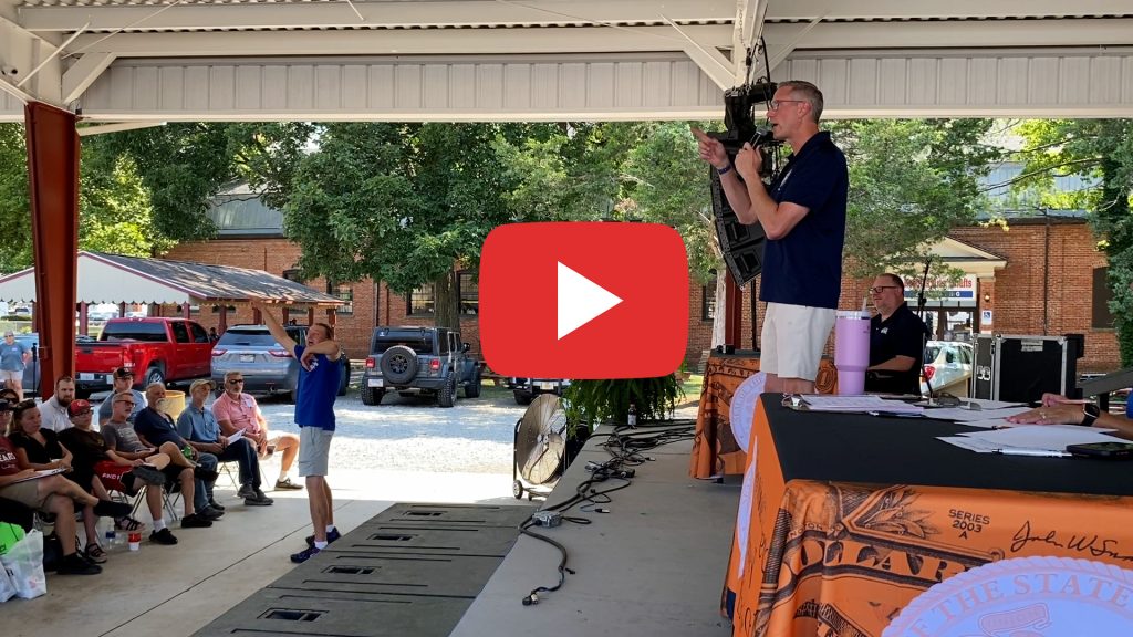 Video: Treasurer Frerichs on a stage at the Illinois State Fair. He is auctioning an item in front of a crowd.