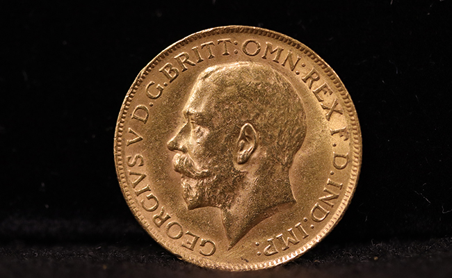 gold British Sovereign coin with the image of King George V