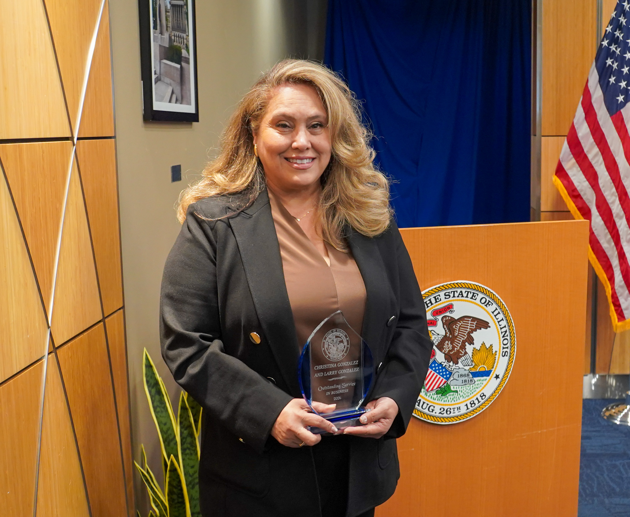 Christy George with her award at Treasurer Frerichs' Black History Month celebration