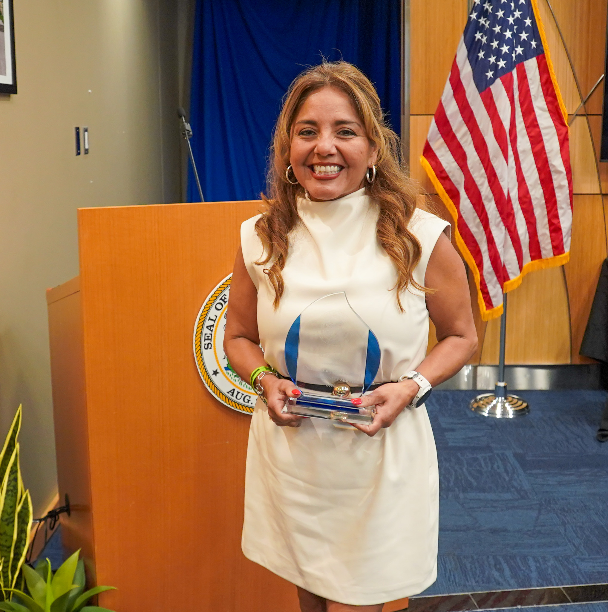 Christy George with her award at Treasurer Frerichs' Black History Month celebration