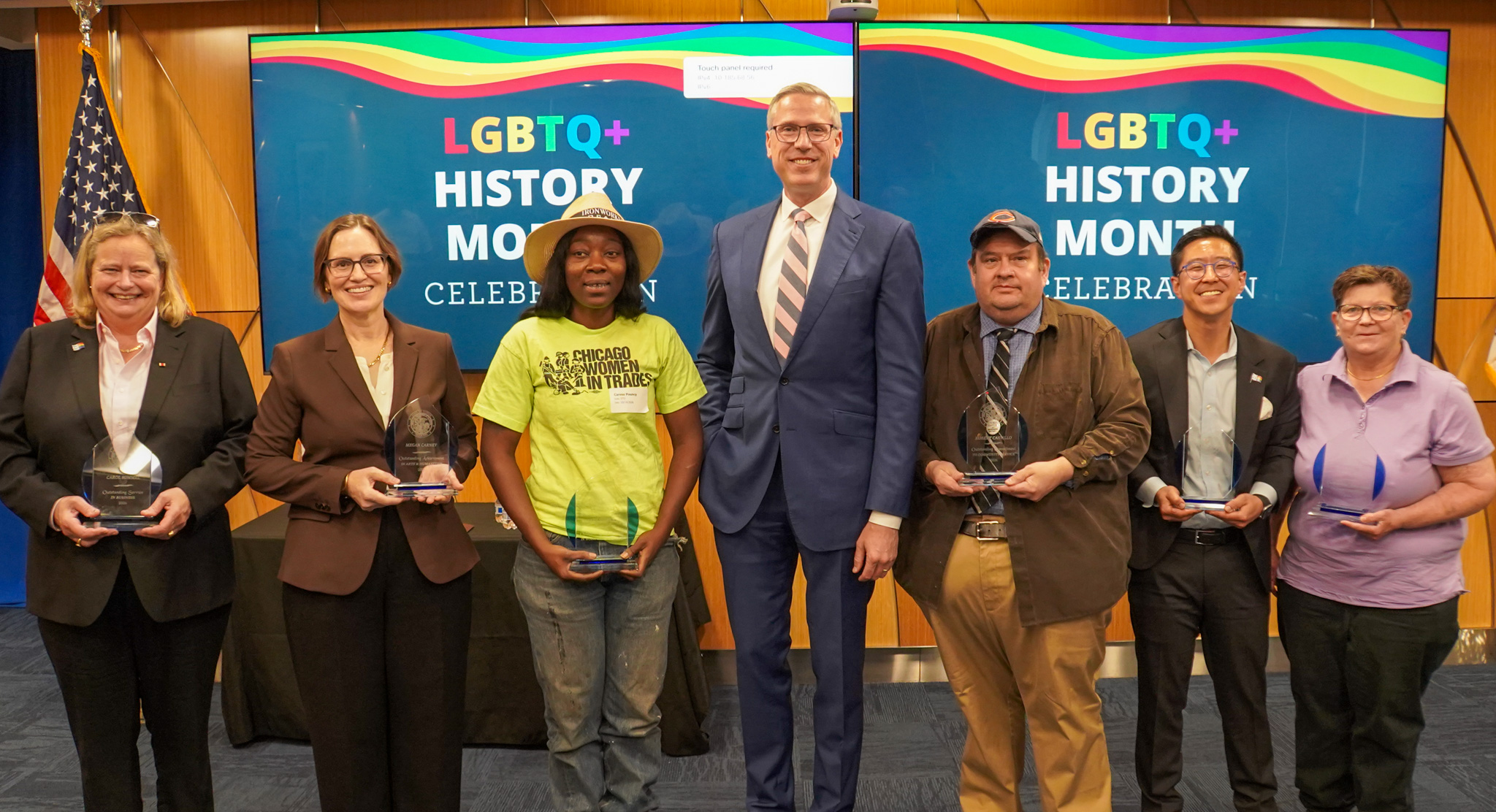 Six award recipients pose with Treasurer Frerichs at the LGBTQ+ History Month celebration