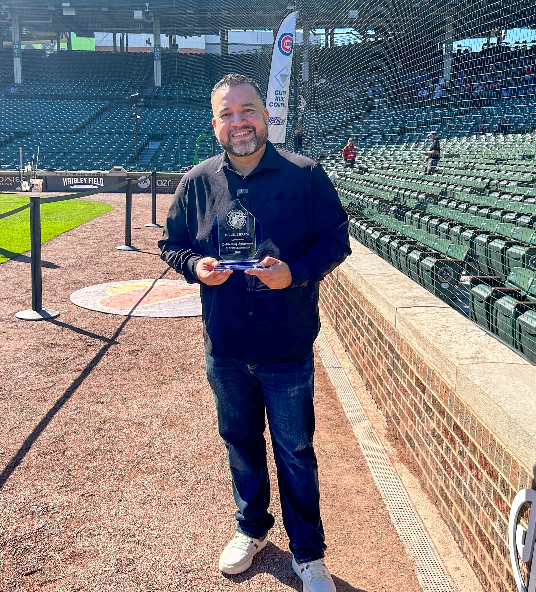 Christopher Mallette with award at Black History Month Event